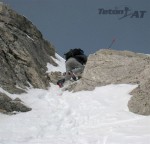 Dustin downclimbs a section in the SE Couloir on the Dike Pinnacle