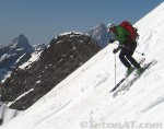 steve-romeo-skis-in-front-of-teewinot-and-the-grand-teton-on-the-northeast-ridge-of-mount-moran