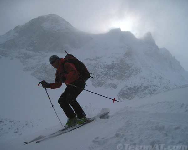 reed-finlay-skis-in-front-of-south-garnet-peaks